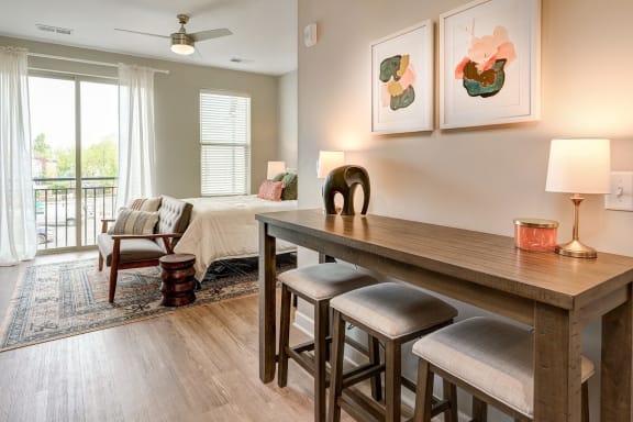 a living room with a dining room table and a couch at Adelphi Quarter, Columbus, Ohio