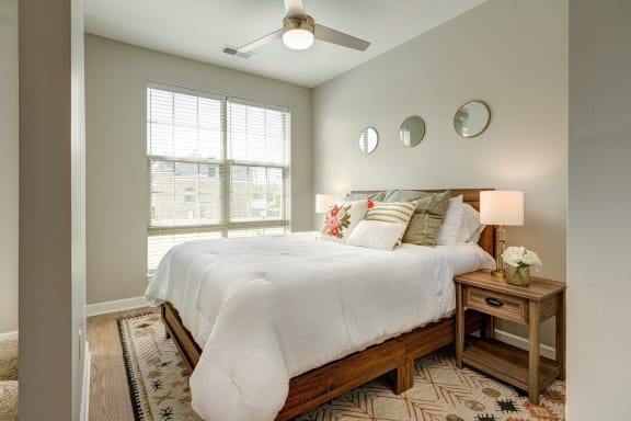a bedroom with a large bed and a window at Adelphi Quarter, Columbus