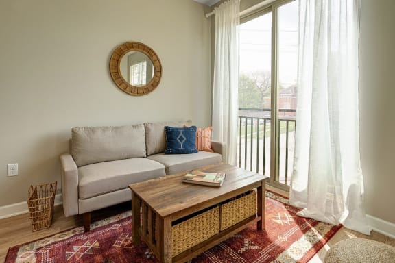 a living room with a couch and a coffee table at Adelphi Quarter, Columbus, 43203
