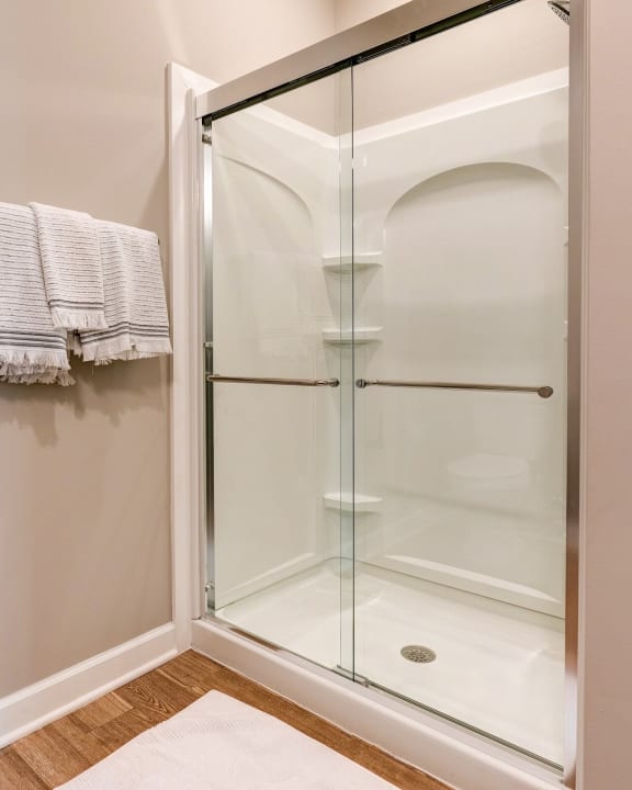 a shower with a glass door in a bathroom at Adelphi Quarter, Columbus, Ohio