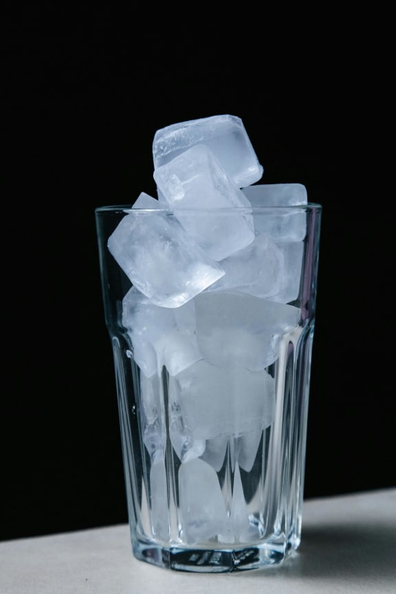 ice cubes in a glass filled with water