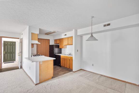 Kitchen with White Island at Providence Glen Apartments, Columbus, OH, 43219