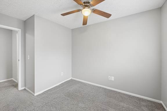 Empty room with golden colored fan at Timbercreek Apts, Columbus, OH 43207