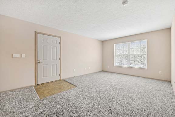 A room with a door and a window.
