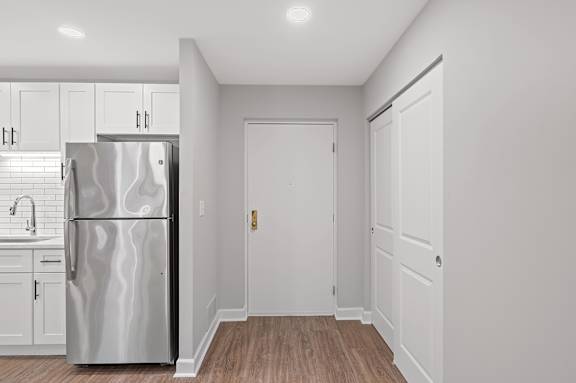 A kitchen with a refrigerator, sink, and cabinets. at Indian Creek Apartments*, Ohio