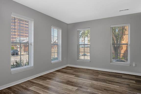 A room with wooden floors and three windows. at Roebling Row, Kentucky, 41011-1720