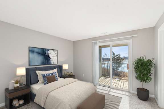 A bedroom with TV at Waterfront Pointe, Indianapolis, IN