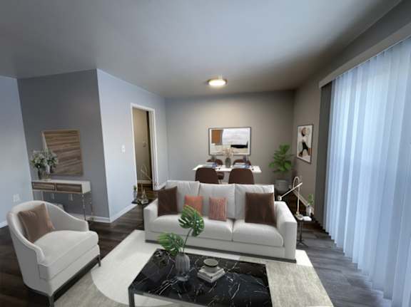 A living room with a white couch and a coffee table.