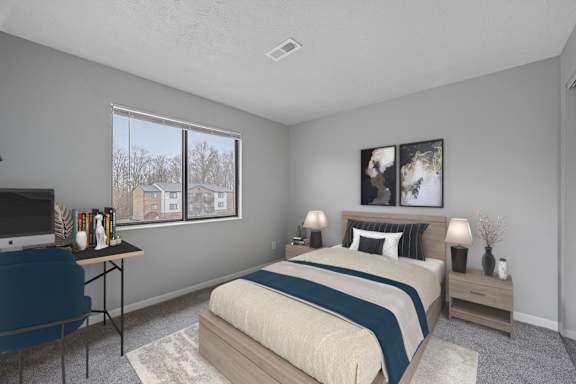 Bedroom with bed and lamp with window at The Reserve at Grand Valley, Milford, 45150