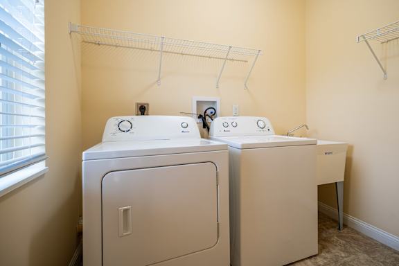A laundry room with a washer and dryer.