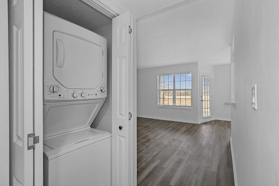 A white washing machine is in a white cabinet in a white room at Indian Lookout Apartments, Ohio, 45449