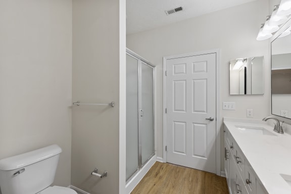 an empty bathroom with a toilet and a shower and a sink at Four Bridges, Ohio