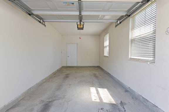 the inside of an empty room with a door and window at Four Bridges, Liberty Township, Ohio
