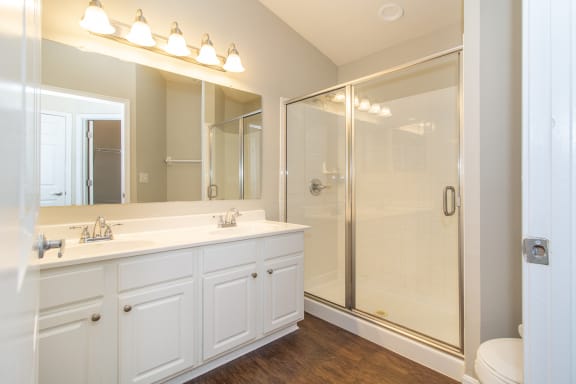 Bathroom with a large mirror and a shower