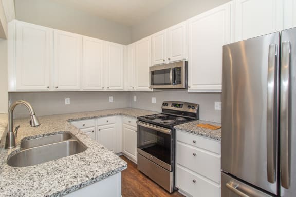 Kitchen with granite counter tops and stainless steel appliances