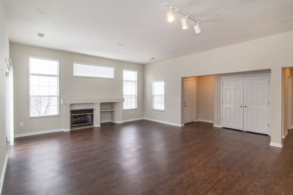 Living room with wood flooring and a fireplace