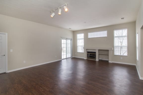 Living room with wood floors and a fireplace