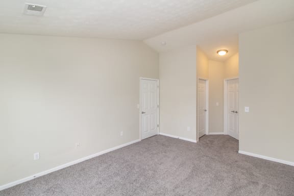 Living room with white walls and carpet