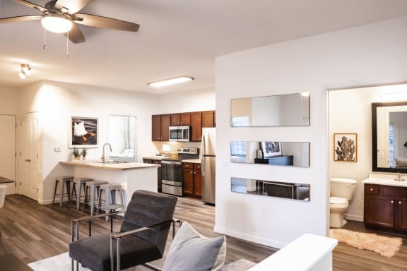 a living room with a kitchen and a dining room at Waterstone Landing, Perrysburg, OH, 43551