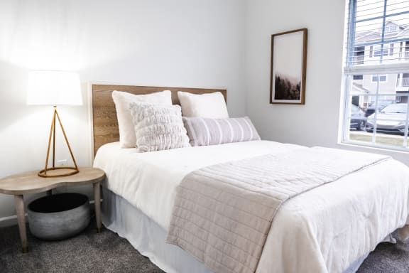 a bedroom with a large bed and a window at Waterstone Landing, Perrysburg