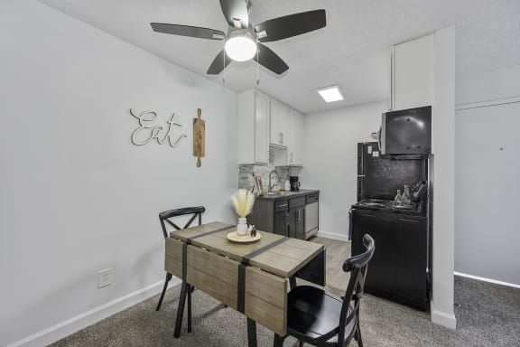 Modern kitchen and dining room are open to the living room and family room
