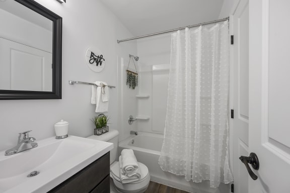 Bathroom with a shower and a sink and a toilet