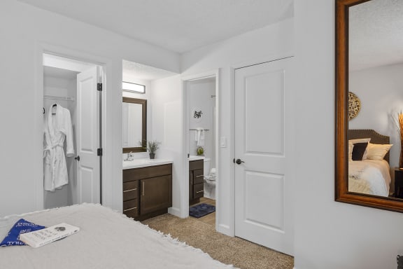 Bedroom with a bed and a bathroom with a sink