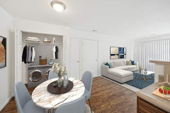 A modern living room with a round table and chairs.