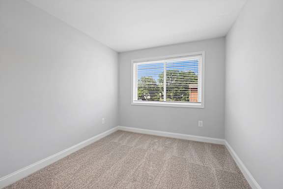 an empty room with white walls and a window at Rose Hill Apartments, Virginia, 22310