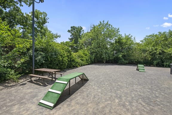 a park with benches and a picnic table  at Bren Mar Apartments, Alexandria, VA