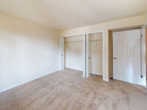 Empty living room at Tysons Glen Apartments and Townhomes, Falls Church