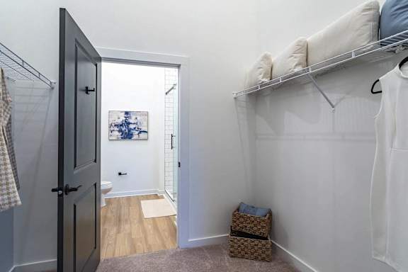 A small room with a bed and a door.