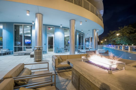 Cozy Fire Pit with Seating at Amaray Las Olas by Windsor Apartments, 215 SE 8th Ave, Fort Lauderdale
