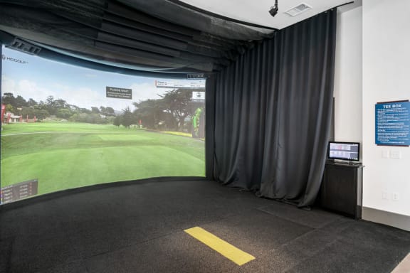 Golf Simulator at Windsor Lakeyard District, an apartment community in North Dallas