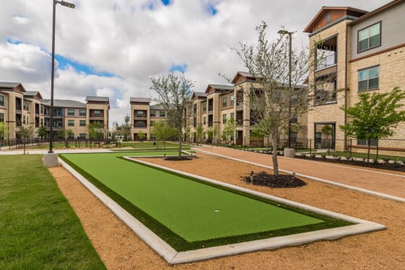 Outdoor Putting Green at Windsor Lakeyard District, an apartment community in North Dallas