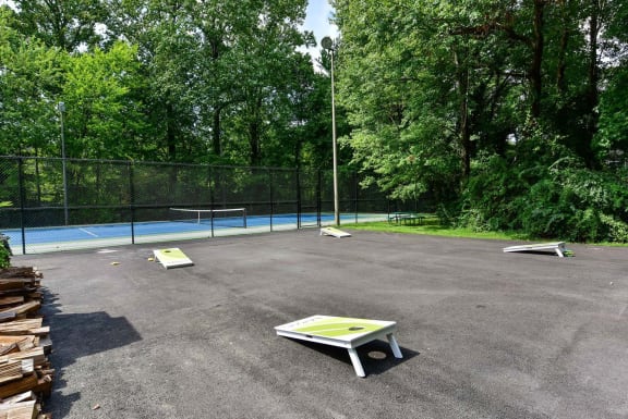 a ping pong table in front of a tennis court