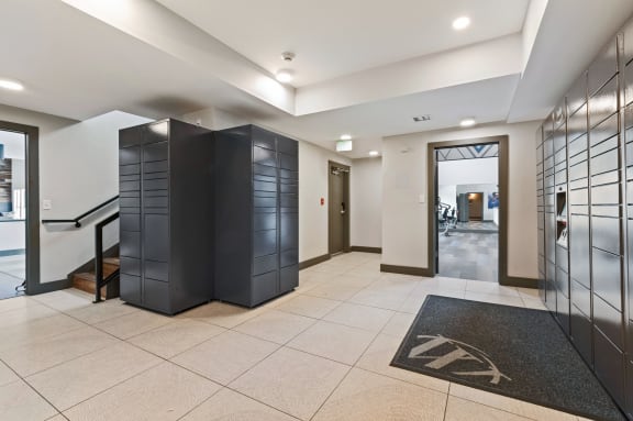 Lobby with elevators and a rug in the center of the room at Windsor Westminster, Westminster, Colorado