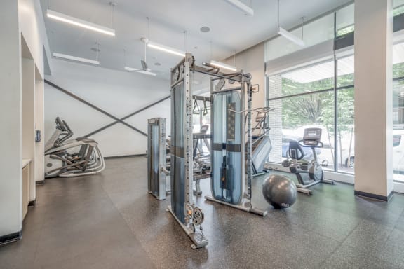 a workout room with weights and other exercise equipment