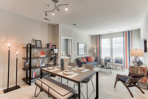 a living room filled with furniture and a large window