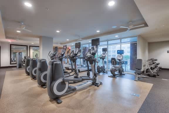 a room filled with lots of cardio exercise equipment