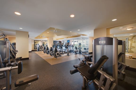 a room filled with lots of different types of exercise equipment