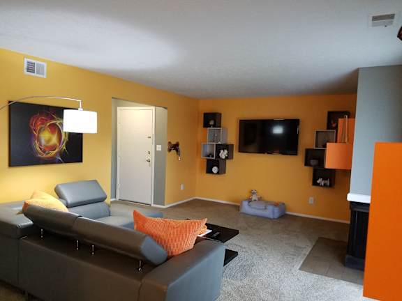 a living room with a couch and a tv