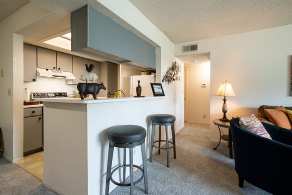 View of the breakfast bar in the kitchen of a two-bedroom model unit at The Lakes.