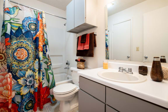 View of the en-suite bathroom within the master bedroom of a two-bedroom model unit at The Lakes.