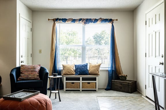 View of the living room window in a two-bedroom model unit at The Lakes.