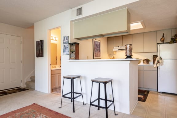 Kitchen bar seating area in a one-bedroom townhome model unit at The Lakes.