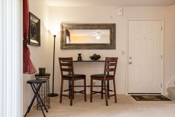 View of the interior entryway within a one-bedroom townhome model unit at The Lakes.