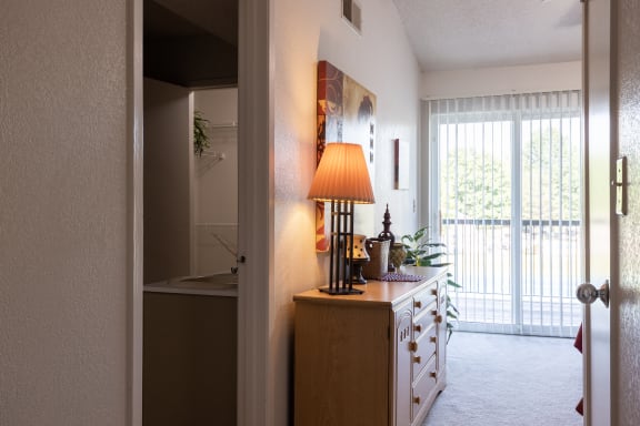 Bedroom and en-suite bathroom entrance in a one-bedroom townhome model unit at The Lakes.