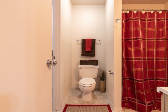 Bathroom toilet in a one-bedroom townhome model unit at The Lakes.