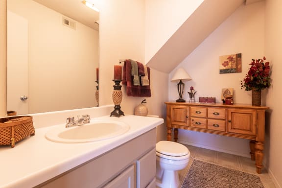 Powder room in a one-bedroom townhome model unit at The Lakes.